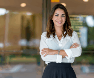- Meixell Diehl Insurance Business woman standing in front of her business smiling