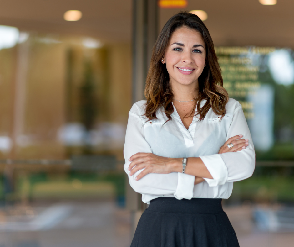 - Meixell Diehl Insurance Business woman standing in front of her business smiling