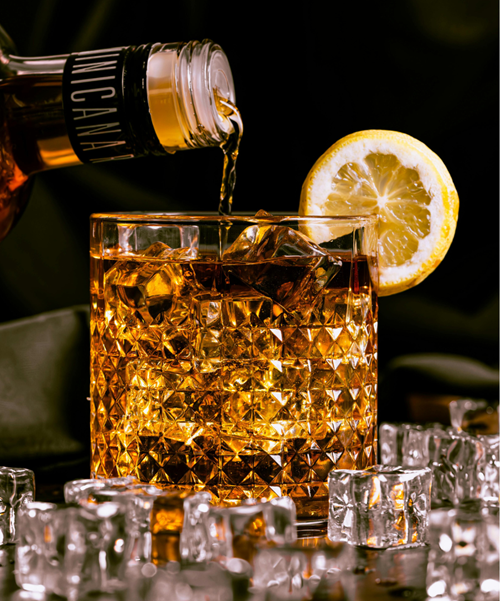 bottle pouring an alcoholic drink